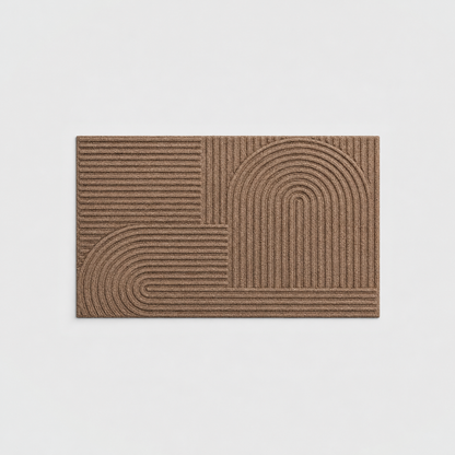 Brown grooved doormat with a raised arc pattern, seen from above on a light gray background