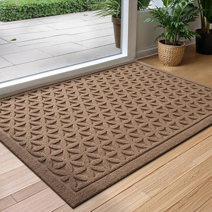 Brown grooved doormat with a raised lattice pattern at a glass door