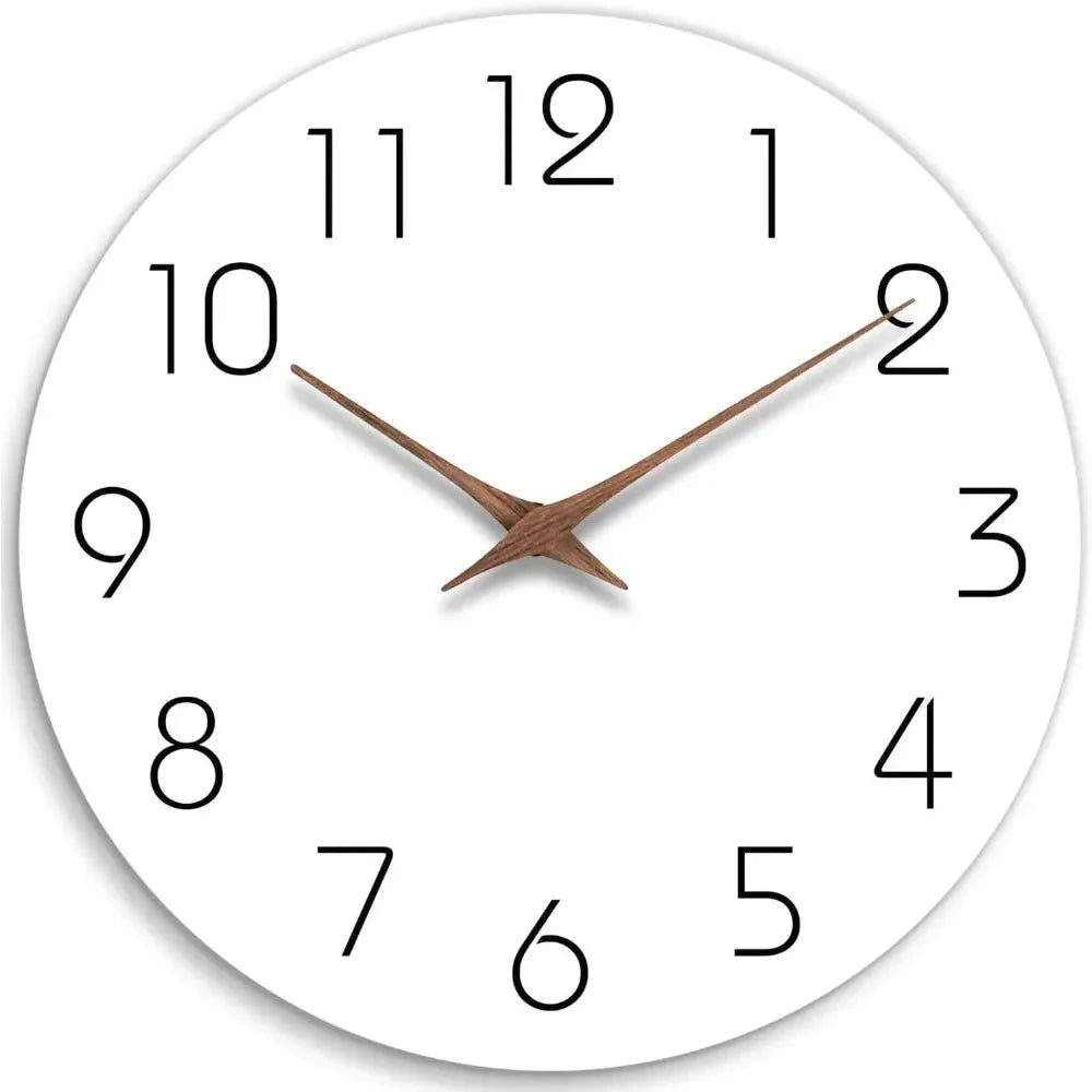 A white round wall clock with thin black numbers and two brown wooden hands, front view on a white background