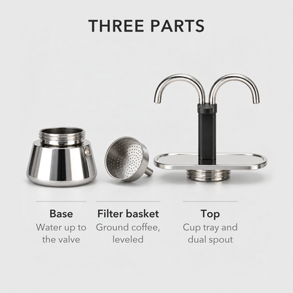 Mini moka pot taken apart into its water base, filter basket and top with cup tray and dual spout