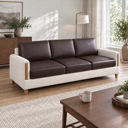 Three-seat sofa with brown PU leather cushion covers in a wood-floored living room with a low coffee table