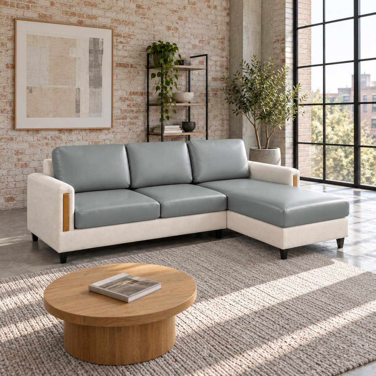 L-shaped sectional with gray PU leather covers on the seat, chaise and back cushions in a loft with large windows
