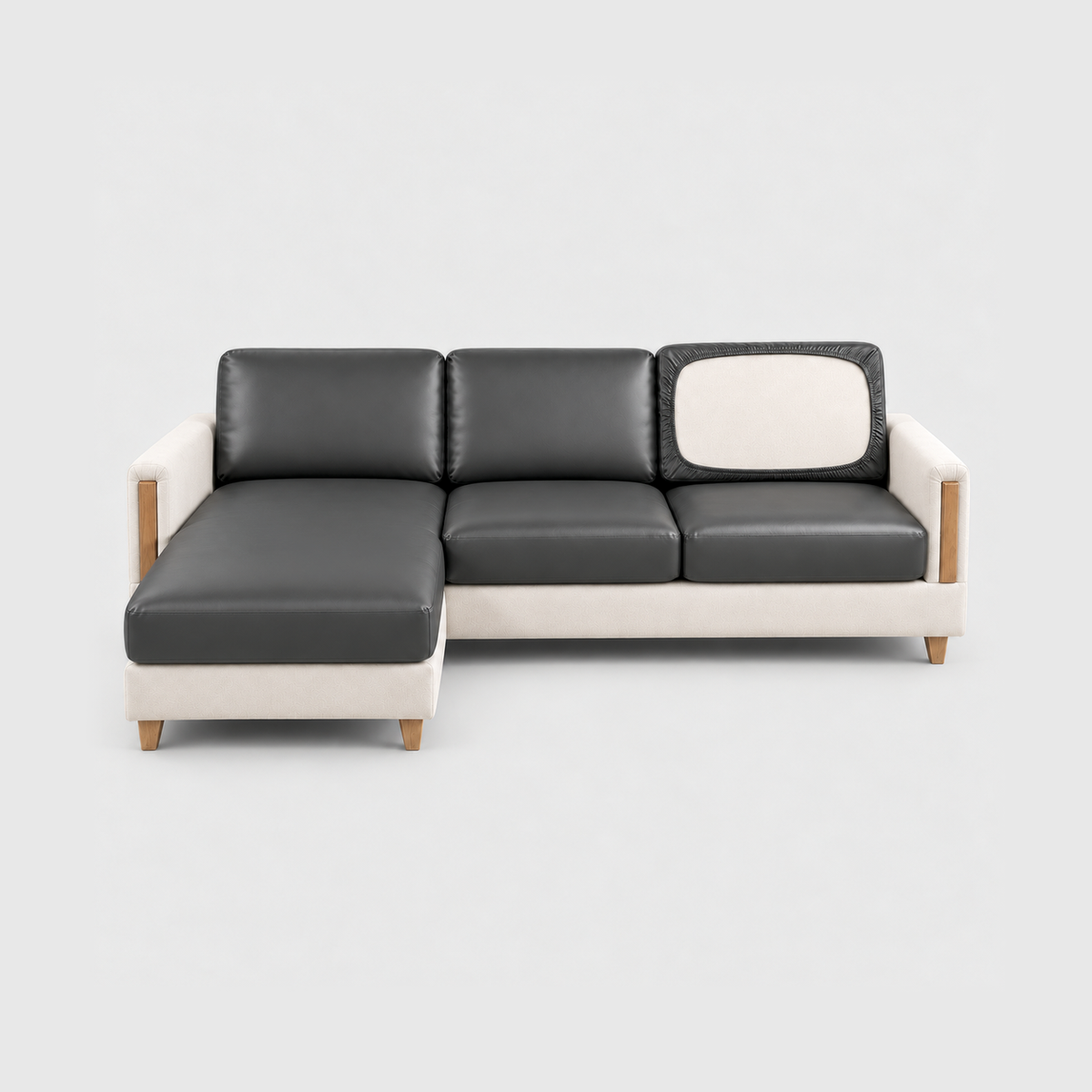Sectional sofa with charcoal PU leather cushion covers on a light gray background