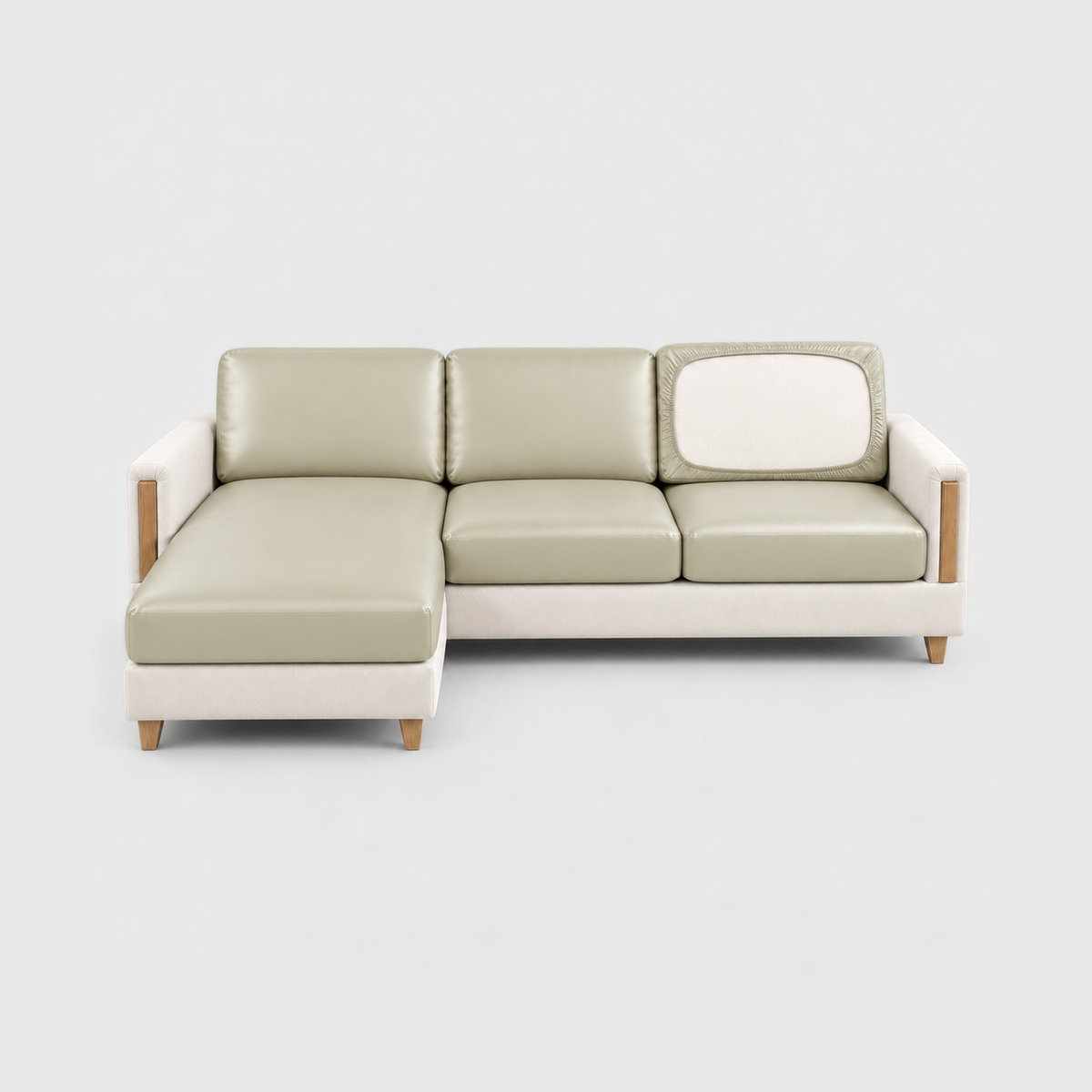 Sectional sofa with cream PU leather cushion covers on a light gray background