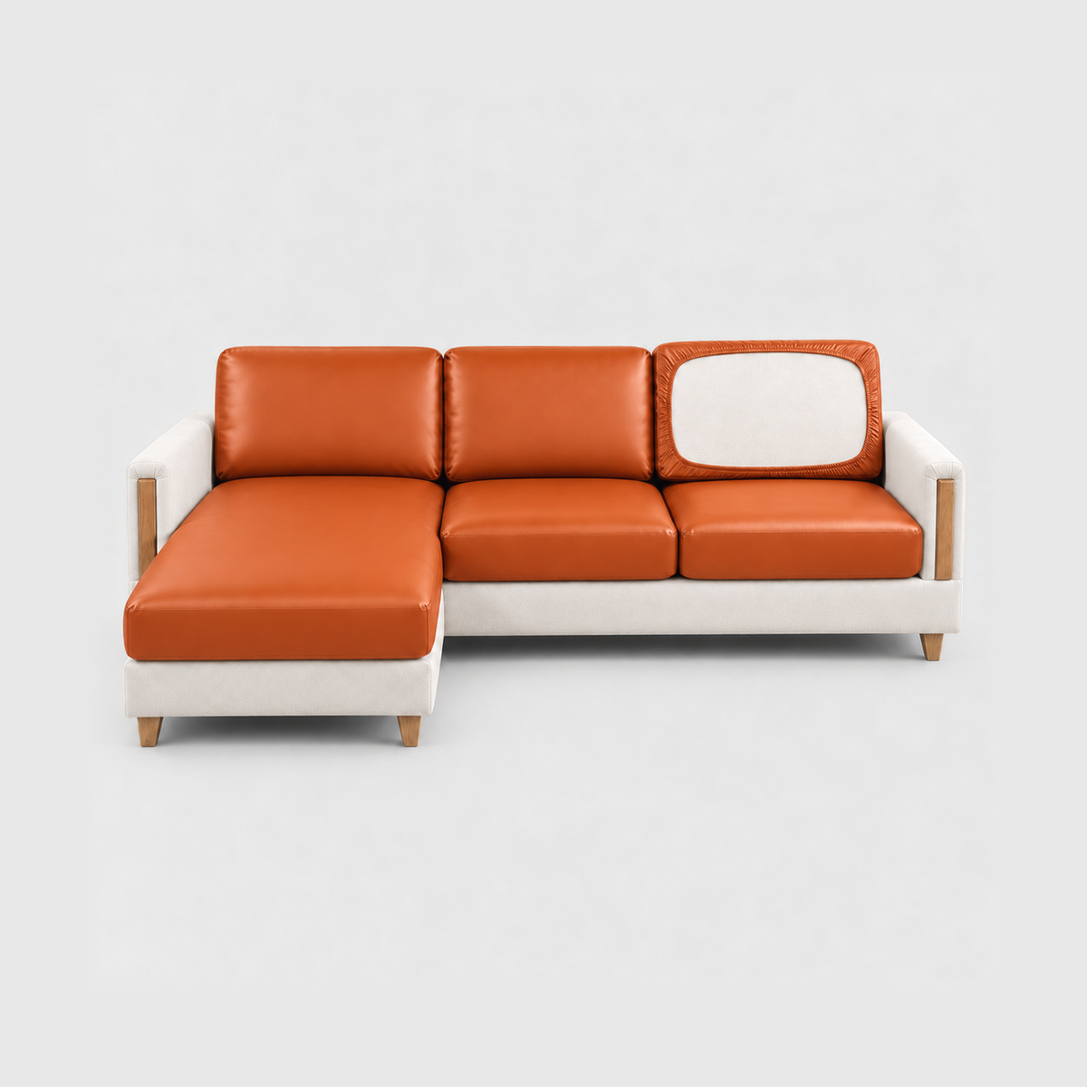 Sectional sofa with orange PU leather cushion covers on a light gray background