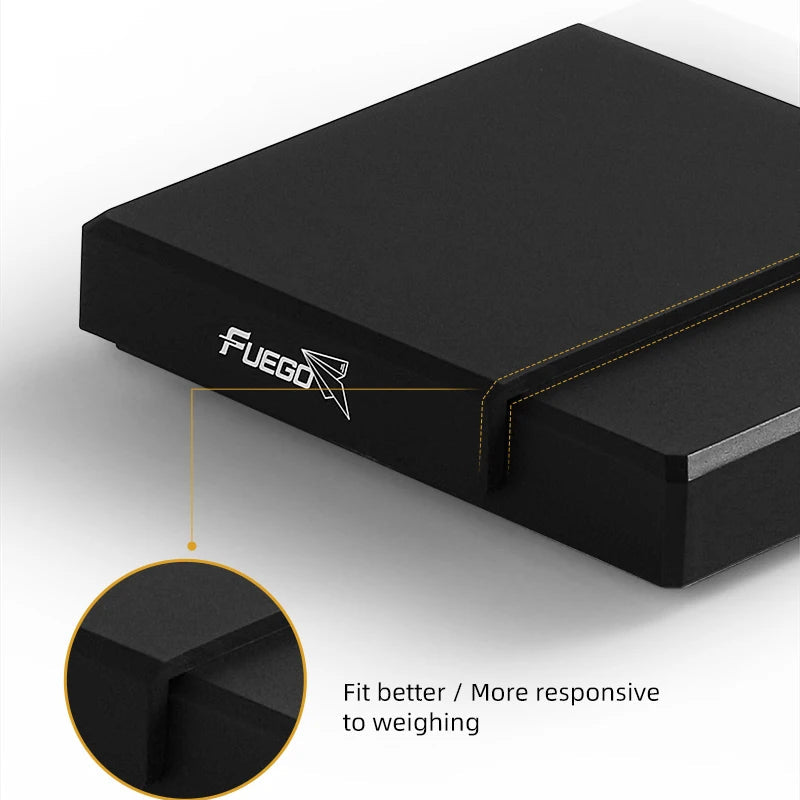 Close-up of the black silicone mat's corner where it folds over the side of the scale