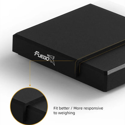 Close-up of the black silicone mat's corner where it folds over the side of the scale