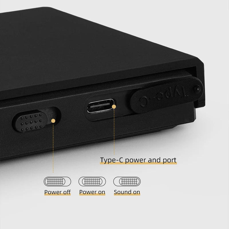 Side of the black coffee scale showing the power and sound slide switch and the USB-C charging port under its rubber cover
