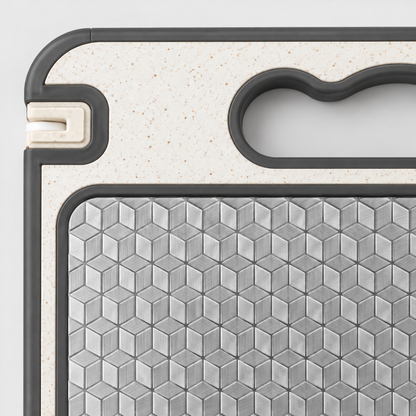 Close-up of the raised cube pattern on the stainless steel side meeting the cream handle end and the gray silicone edge