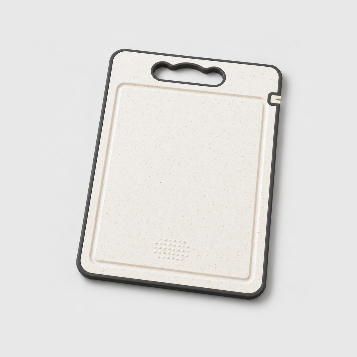 Fruit and veg side of the double sided cutting board with a juice groove and a grinding area, on a light gray background