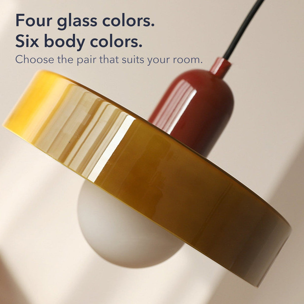 Close-up of an olive glass ring shade on a burgundy body with the words Four glass colors. Six body colors.