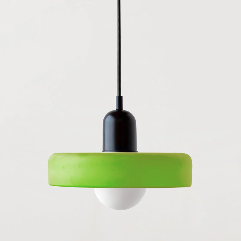 Bauhaus pendant light with a matte green glass ring shade and a black body