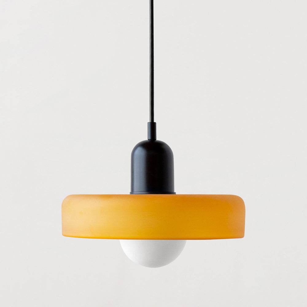 Bauhaus pendant light with a matte amber glass ring shade and a black body