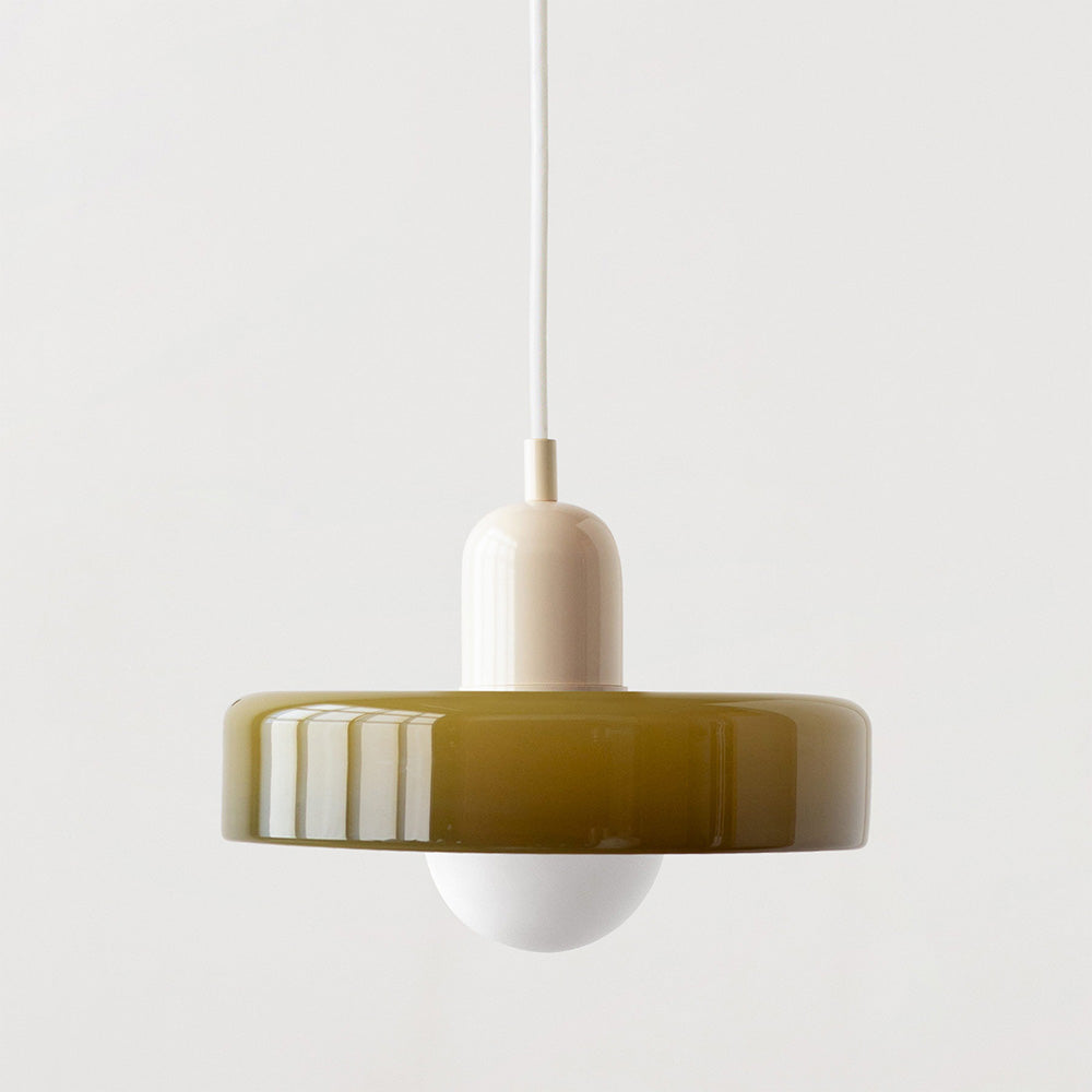 Bauhaus pendant light with a glossy olive glass ring shade, a beige body and a white cord