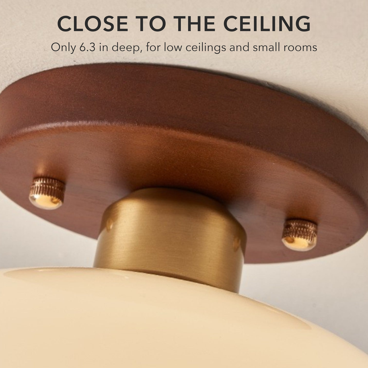 Close-up of the light's brown ceiling base, brass-tone neck and screws, with the words Close to the ceiling, only 6.3 in deep