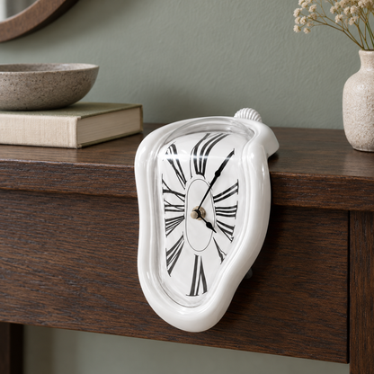 A glossy white melting clock draped over the edge of a dark oak console table in a hallway
