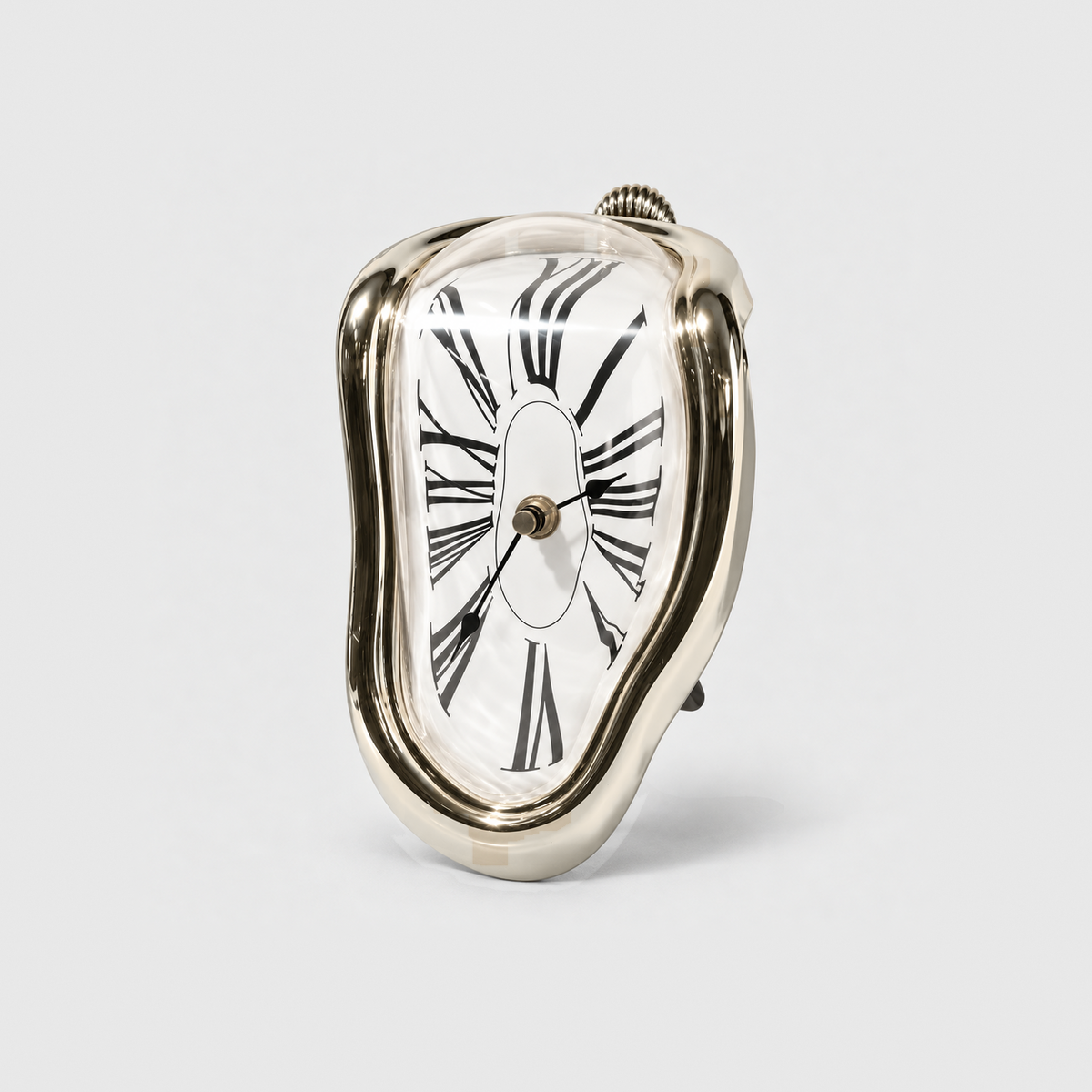 A mirror gold melting clock with stretched Roman numerals standing on a light gray background