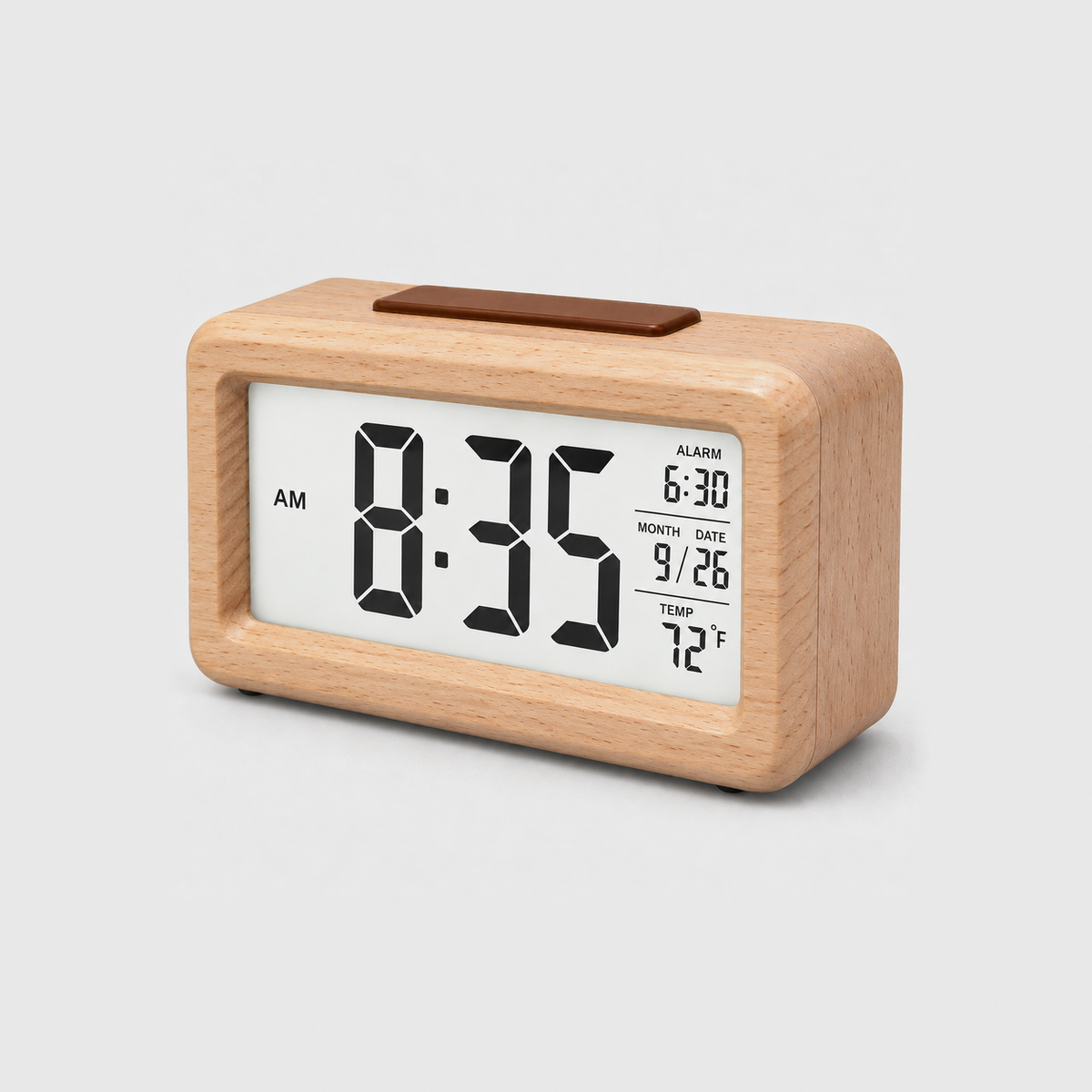 Wooden alarm clock in beige, pale wood all over, with a lit screen showing time, alarm, date and temperature, on a light gray background