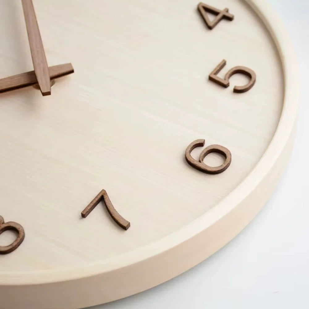 Close-up of the natural wood clock face showing the raised walnut numbers 4 to 8 and the rounded wooden rim