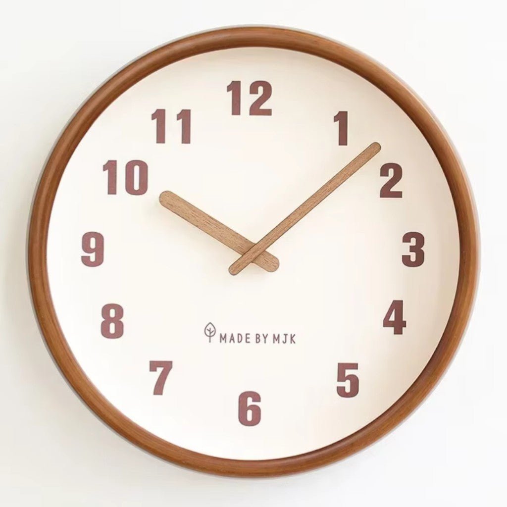 Straight-on front view of the White clock with its wood frame, large numbers and wooden hands