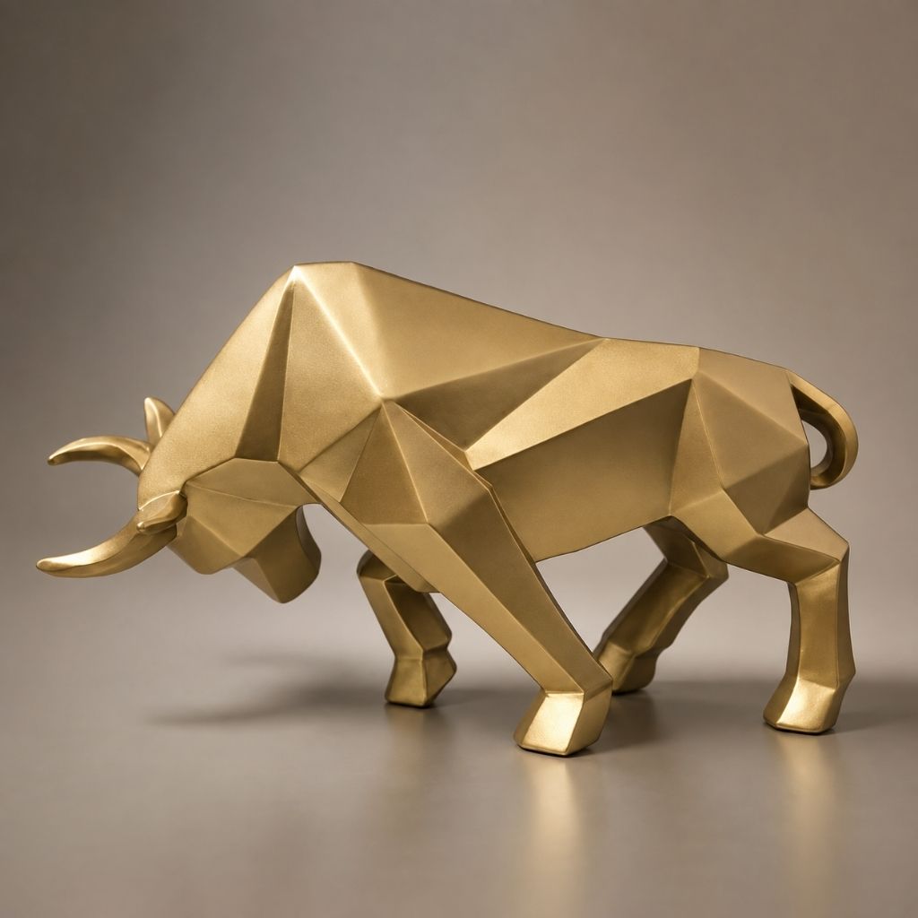 A gold geometric bull sculpture on a plain warm gray surface