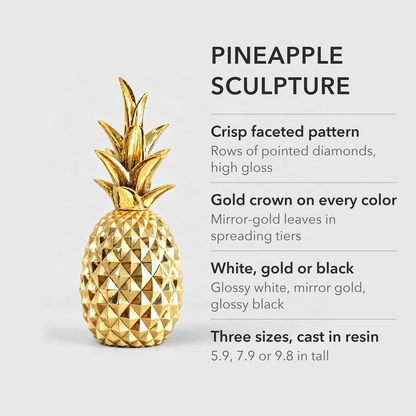 Text image: Pineapple sculpture in resin with a crisp faceted pattern and a gold crown, in white, gold or black