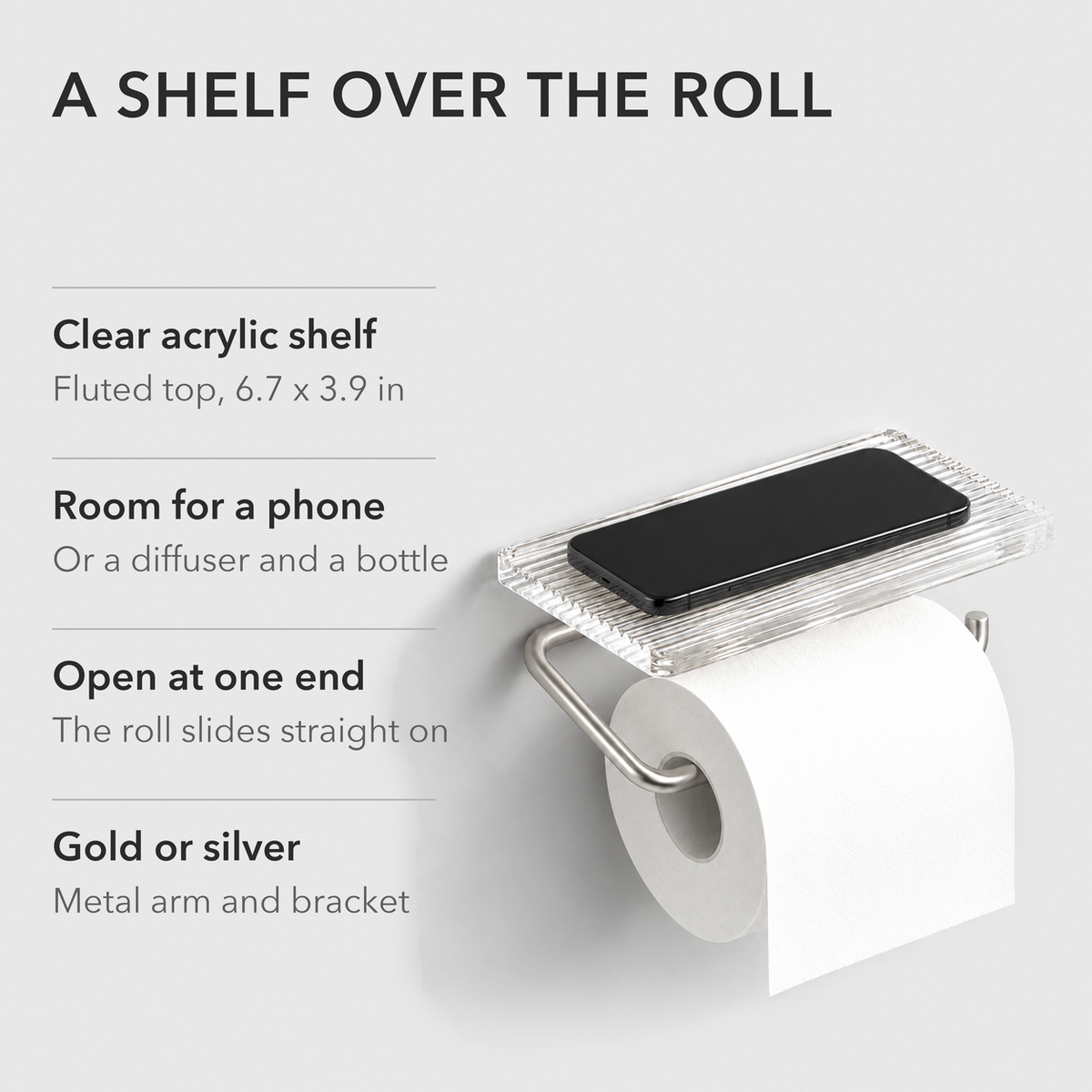 Text card reading A shelf over the roll, listing the clear fluted acrylic shelf, room for a phone, the open end and the gold or silver finish, beside the silver holder with a phone on its shelf