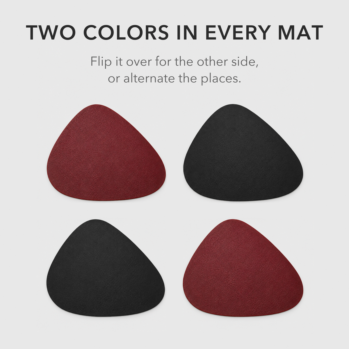 Four Burgundy and Black placemats laid two by two, alternating burgundy and black sides, with the words Two colors in every mat