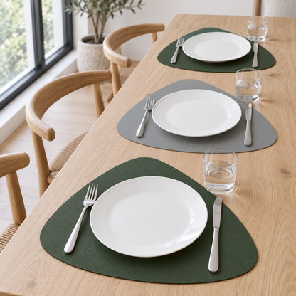 Gray and Green placemats on a long white oak table by a window, green and gray sides alternating