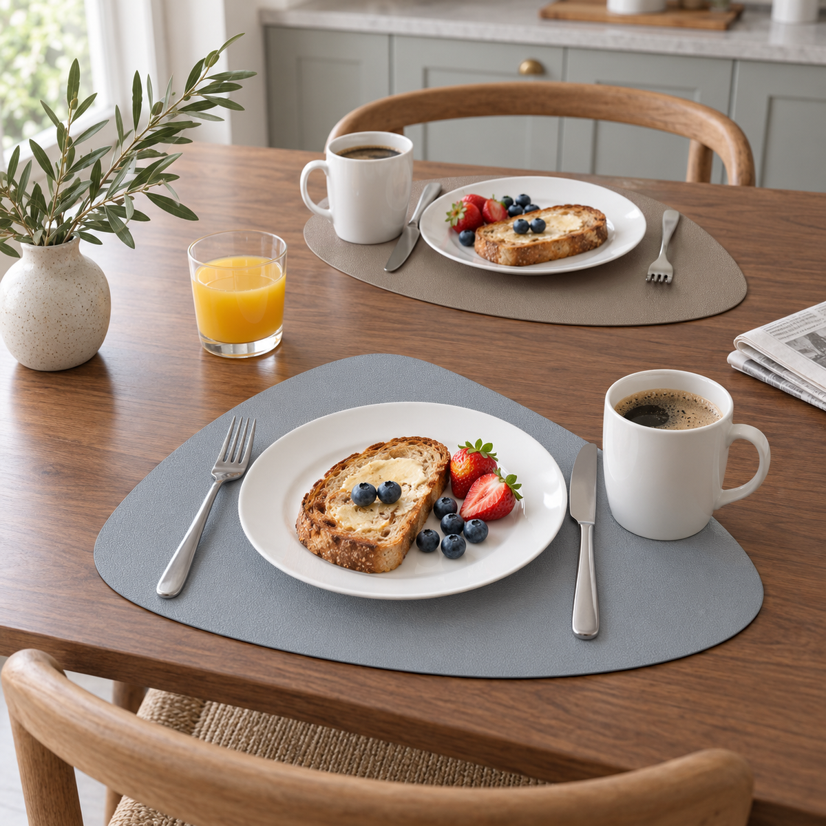 Gray and Taupe placemats set for breakfast on a walnut table, one gray side and one taupe side