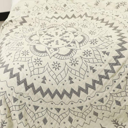Close-up of the mandala rings on the cream face, a gray zigzag ring around pointed petals and diamonds