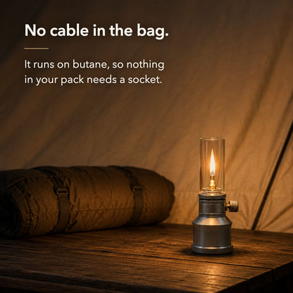 No cable in the bag. It runs on butane, so nothing in your pack needs a socket.