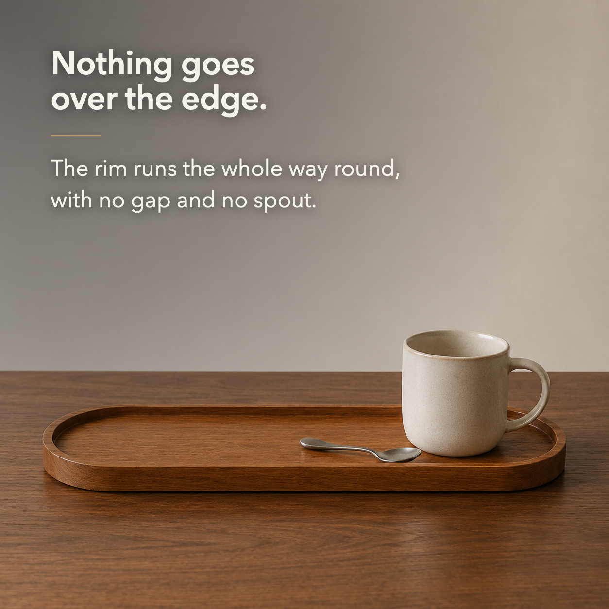 The raised rim runs the whole way round the tray, with no gap and no spout