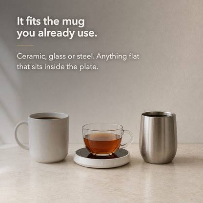 A ceramic mug, a glass cup and a steel tumbler beside the warmer, with the words it fits the mug you already use