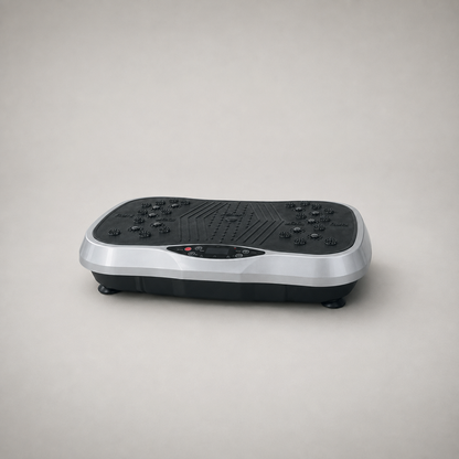 Silver and black vibration plate on a plain grey studio background, three quarter view