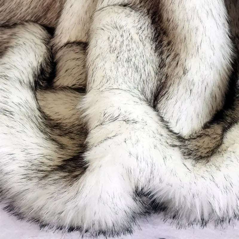 Close-up of the silver throw's fur, white strands darkening to black at the tips