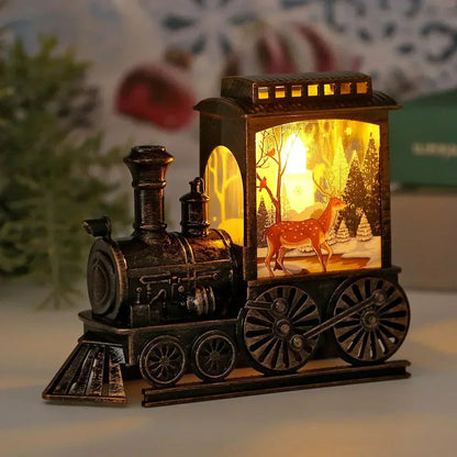 Lit vintage train lantern with a reindeer walking through a snowy forest on the cab panel and warm light in the roof vents
