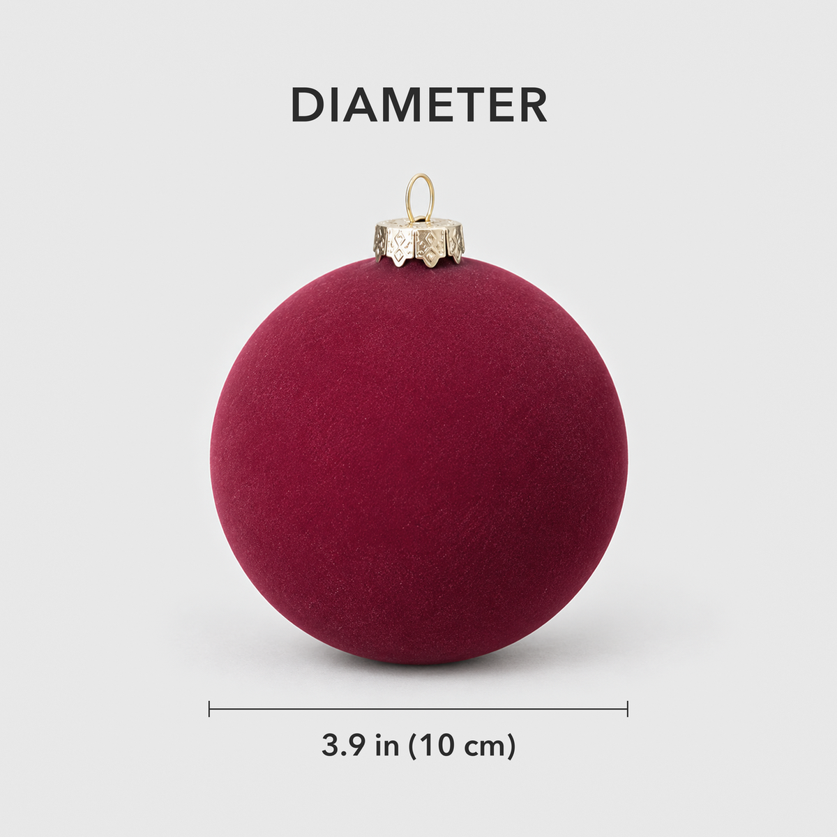 One burgundy velvet bauble measuring 3.9 inches, 10 centimeters, across