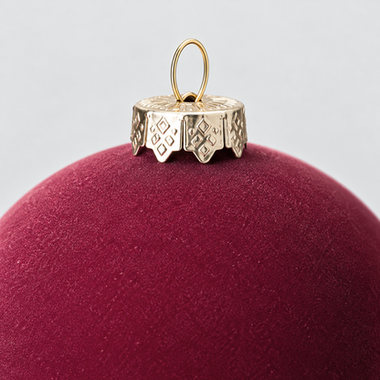 Close-up of the velvet surface and the silver-gold crown cap with its wire loop