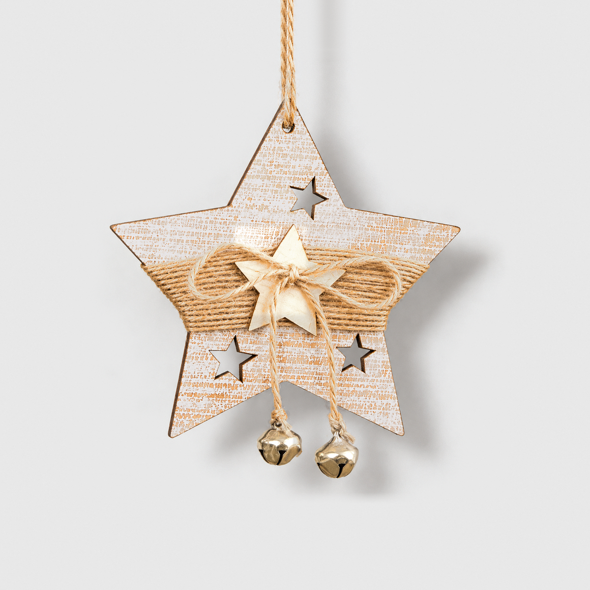 White-washed wooden star Christmas ornament with a twine band, wooden star and two small bells