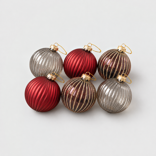 Six ribbed glass Christmas baubles in deep red matte, wine red with gold glitter stripes and smoky gray glass