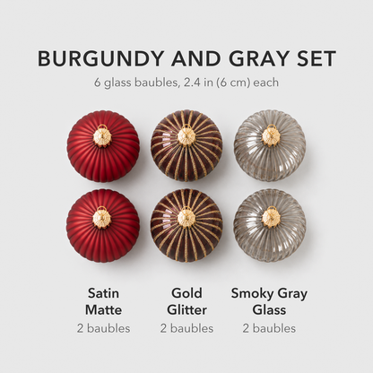 What is in the burgundy and gray set: two matte red, two gold glitter striped and two smoky gray glass baubles