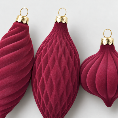 Close-up of the swirled, ribbed and diamond-patterned velvet ornaments and their gold-tone caps