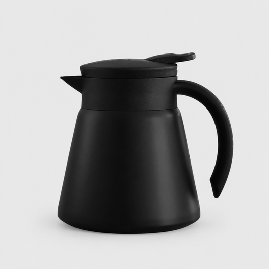 Black thermal coffee carafe with a press lever lid, triangular spout and black handle on a light gray background