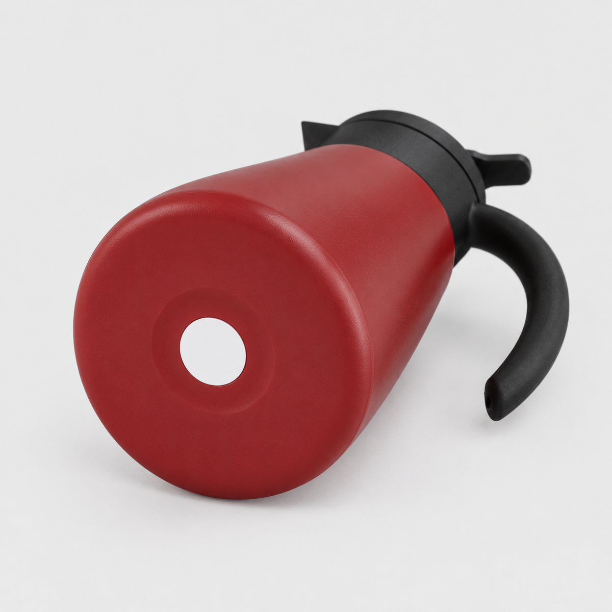 Underside of the red thermal carafe showing the flat base with a recessed ring and white center disc