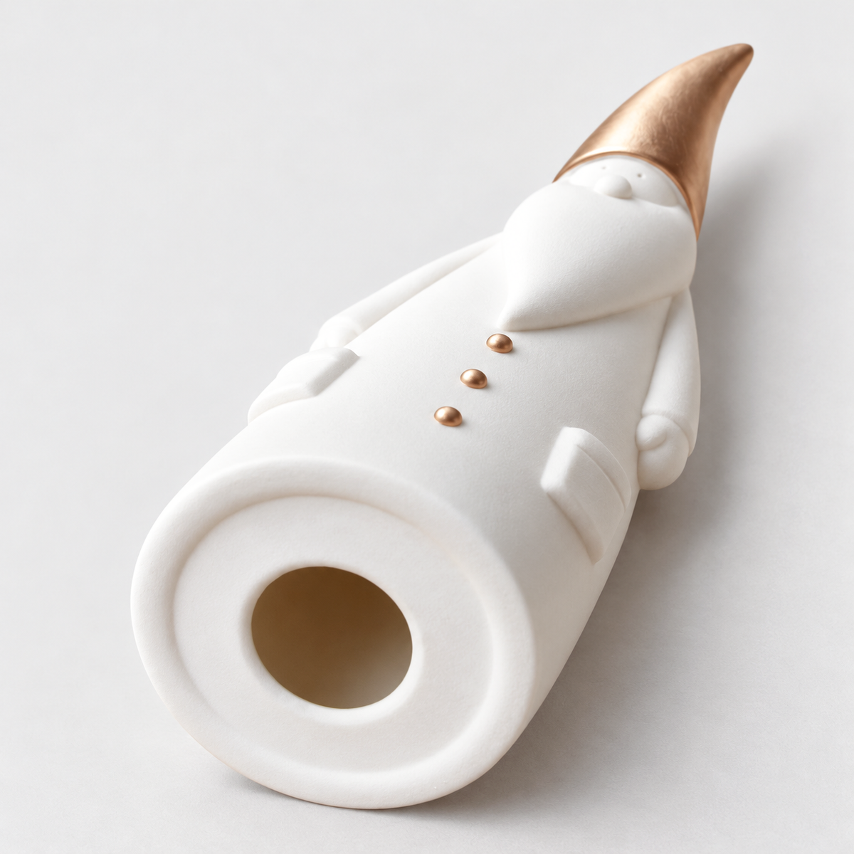 Underside of a white ceramic Santa figurine lying on its back, showing the flat base ring and the round opening into the hollow body