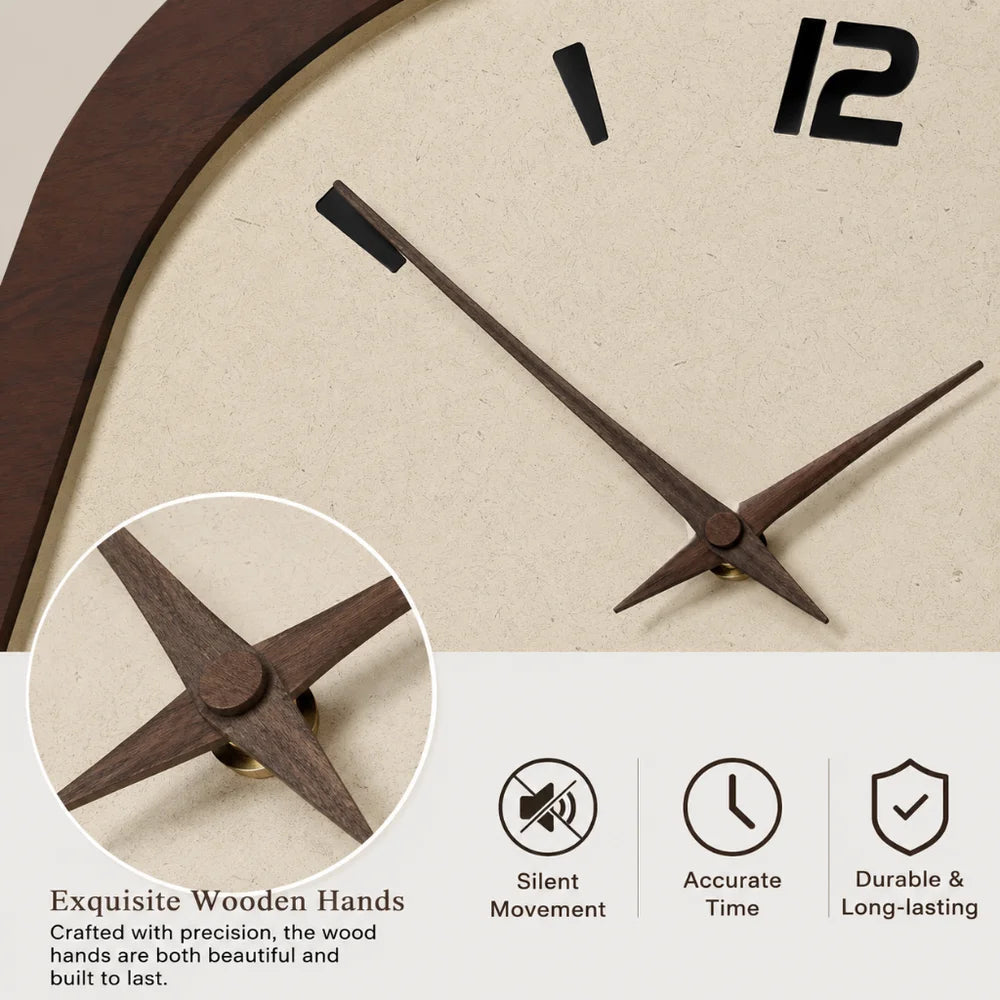 Close-up of the clock's slim wooden hour and minute hands and their round wooden center cap