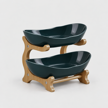 Two-tier fruit bowl stand with glossy deep green bowls on a bamboo frame, on a light gray background