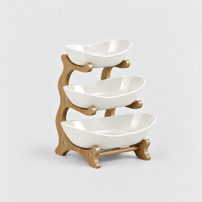 Three-tier fruit bowl stand with glossy white bowls on a bamboo frame