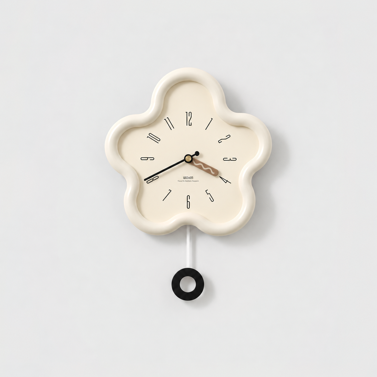 Cream flower shaped pendulum wall clock with a cream dial and a black ring pendulum on a light gray background